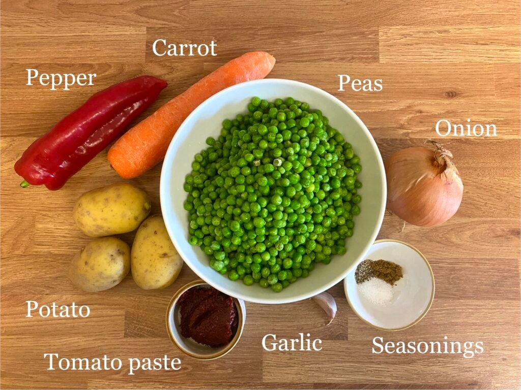 Ingredients for recipe: peas, peppers, carrots, onion, seasonings, garlic, tomato paste and potato