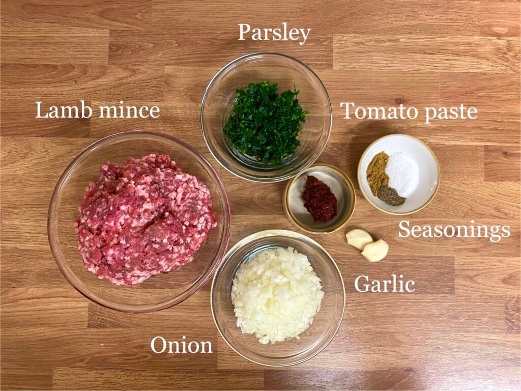 Ingredients for recipe: lamb mince, parsley, onion, garlic, tomato paste and seasonings