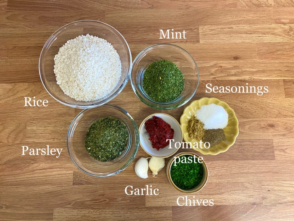 Ingredients for recipe: pudding rice, mint, parsley, sun-dried tomato paste, gerlic, chives and seasonings.