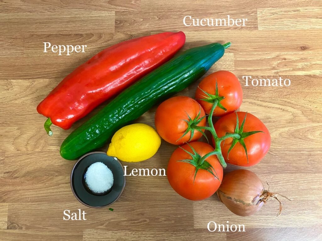 Ingredients for recipe: pepper, cucumber, tomatoes, lemon, salt and onion.