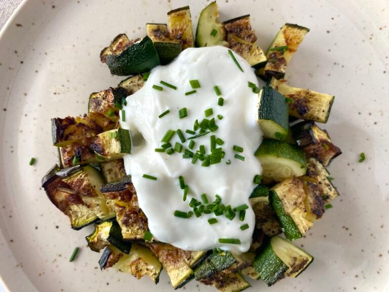 Air fryer courgette zucchini recipe with garlic Greek yoghurt and chives.