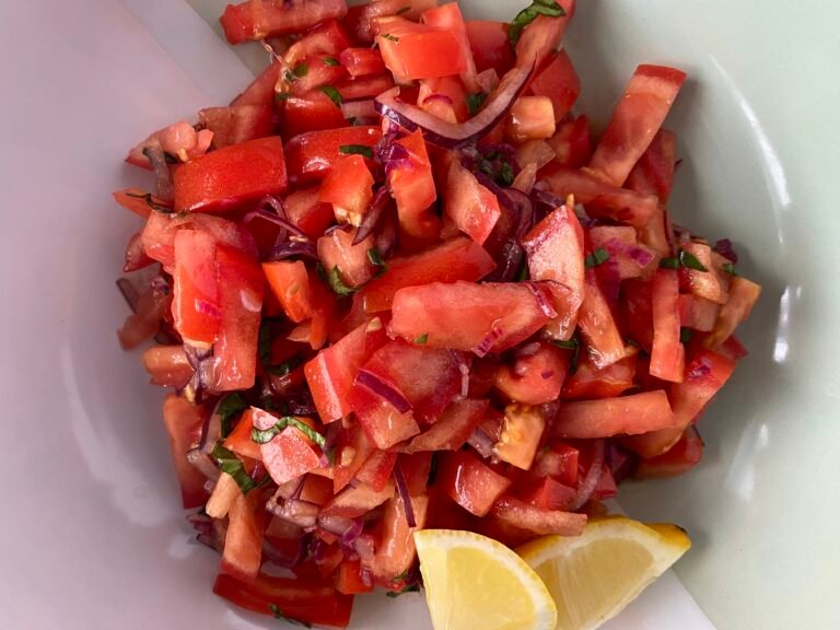 Fisherman's Salad served with lemon wedges.