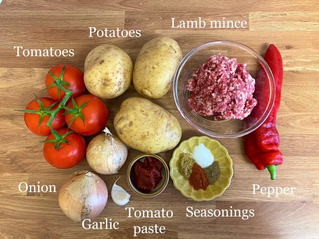 Ingredients for recipe: potatoes, lamb mince, pepper, seasonings, tomatoes, onion, garlic, tomato paste and seasonings.